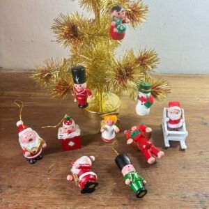 Charming job lot of 10 vintage 1990s painted mini wooden Christmas tree ornaments including Santas, soldiers, angel, snowman, and sleigh.